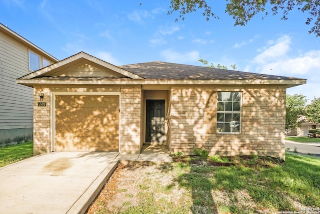 5503 Hidden, San Antonio, TX 78252 - single story home with brick siding, concrete driveway, a garage, and a shingled roof