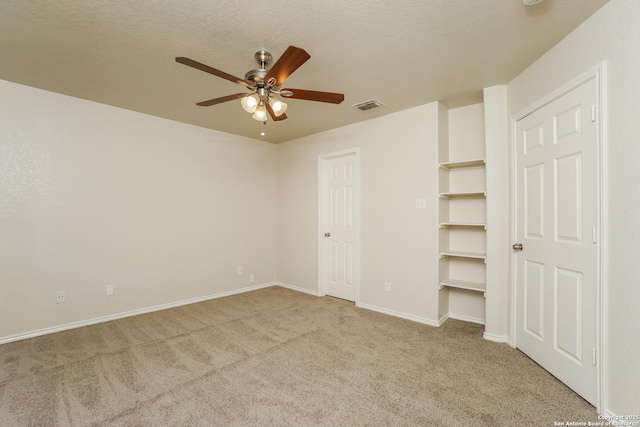 5503 Hidden, San Antonio, TX 78252 - unfurnished bedroom featuring light carpet, baseboards, and ceiling fan