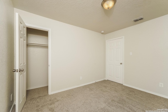 5503 Hidden, San Antonio, TX 78252 - unfurnished bedroom featuring carpet floors, a closet, baseboards, and a textured ceiling