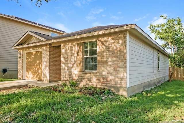 5503 Hidden, San Antonio, TX 78252 - view of home's exterior featuring a garage, driveway, and brick siding