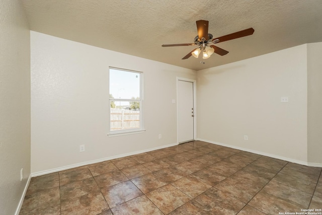 5503 Hidden, San Antonio, TX 78252 - empty room with ceiling fan, baseboards, and a textured ceiling
