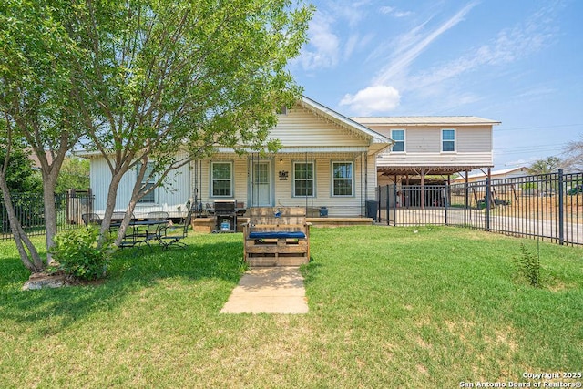 1004 Leona, Cotulla, TX 78014 - rear view of property featuring covered porch