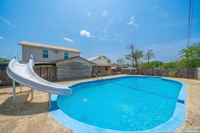 1004 Leona, Cotulla, TX 78014 - view of pool featuring a water slide and fence