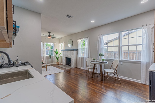 1641 W Huisache, San Antonio, TX 78201 - kitchen featuring wood finished floors, ceiling fan, baseboards, light stone counters, and recessed lighting