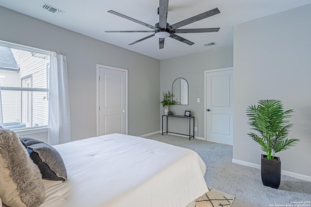 1641 W Huisache, San Antonio, TX 78201 - bedroom with light carpet, baseboards, multiple windows, and ceiling fan