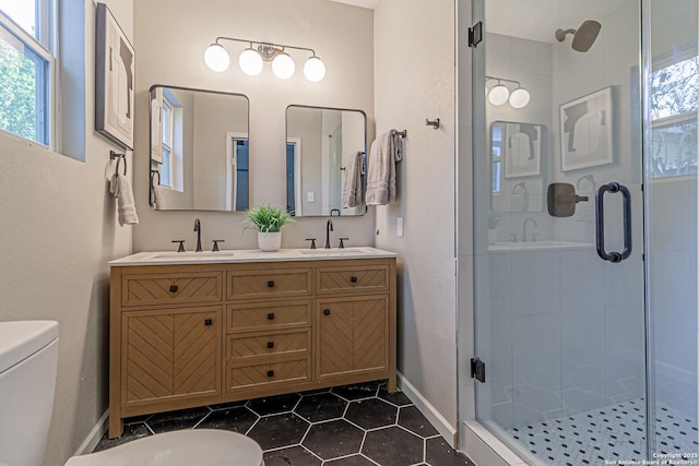 1641 W Huisache, San Antonio, TX 78201 - full bathroom featuring toilet, a shower stall, tile patterned flooring, double vanity, and baseboards