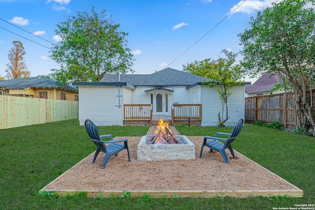 1641 W Huisache, San Antonio, TX 78201 - rear view of house with a fire pit and a wooden deck