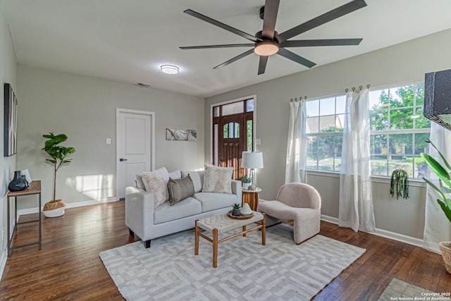 1641 W Huisache, San Antonio, TX 78201 - living room featuring a ceiling fan, dark wood finished floors, healthy amount of natural light, and baseboards