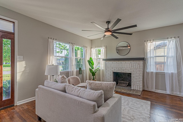 1641 W Huisache, San Antonio, TX 78201 - living room with dark wood-style floors, ceiling fan, baseboards, and a brick fireplace