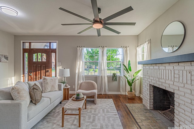 1641 W Huisache, San Antonio, TX 78201 - living room featuring wood finished floors, ceiling fan, a fireplace, and baseboards