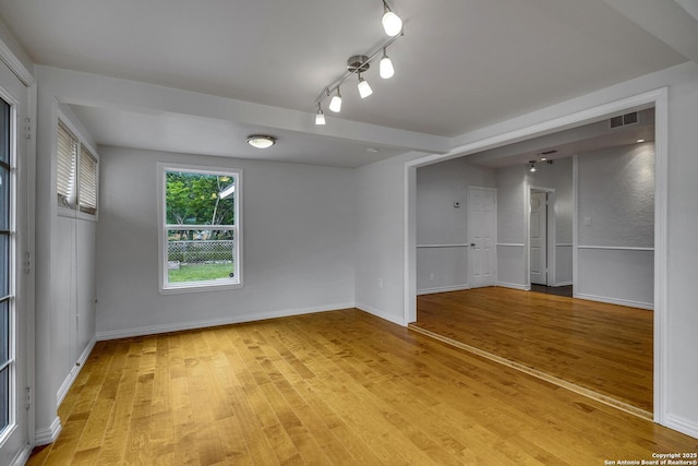 2802 Bent Bow, San Antonio, TX 78209 - empty room with light wood-style flooring, baseboards, and track lighting