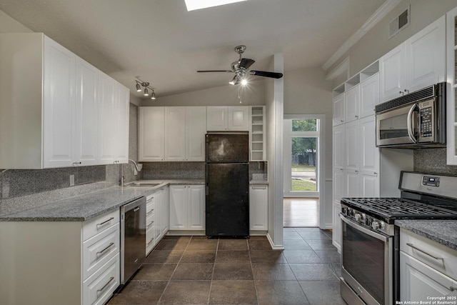 2802 Bent Bow, San Antonio, TX 78209 - kitchen with stainless steel appliances, a sink, tasteful backsplash, white cabinets, and lofted ceiling