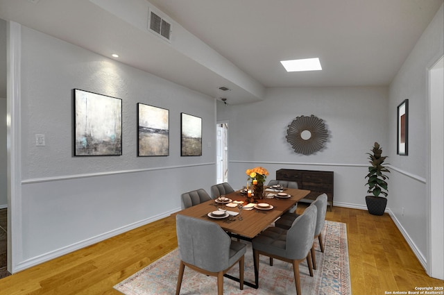 2802 Bent Bow, San Antonio, TX 78209 - dining room featuring a skylight, wood finished floors, and baseboards