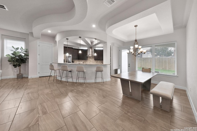 6514 Comanche Post, San Antonio, TX 78233 - dining area with a chandelier, recessed lighting, a raised ceiling, and baseboards