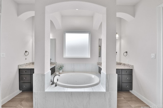 6514 Comanche Post, San Antonio, TX 78233 - bathroom with vanity, a whirlpool tub, and baseboards