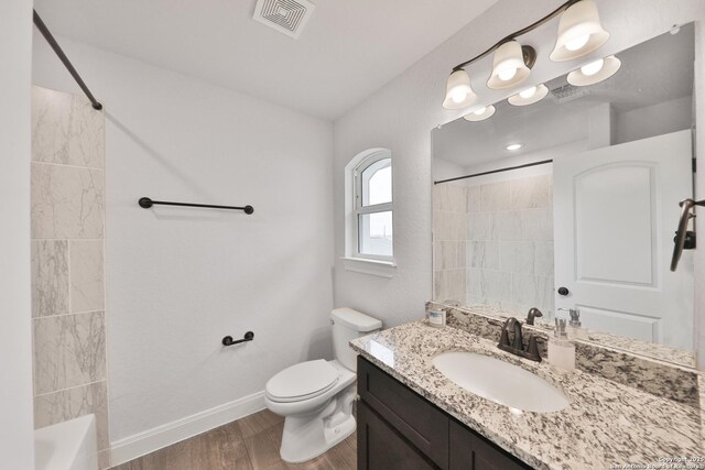 6514 Comanche Post, San Antonio, TX 78233 - bathroom with wood finished floors, toilet, baseboards, vanity, and shower / bathtub combination