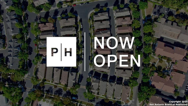 aerial overview of property's location featuring nearby suburban area