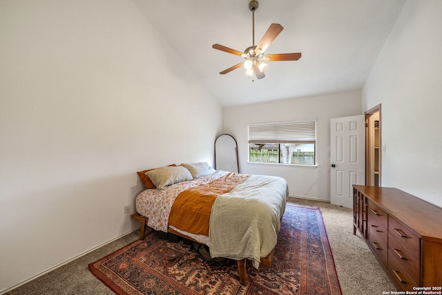 carpeted bedroom with high vaulted ceiling and a ceiling fan
