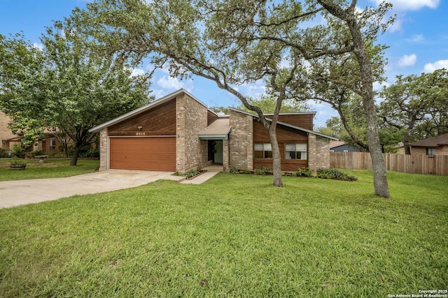 mid-century home with concrete driveway, an attached garage, and brick siding