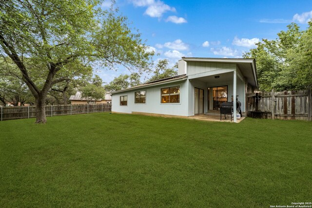 rear view of house featuring a patio