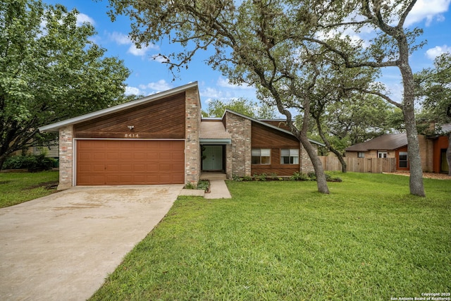 mid-century inspired home with driveway, a garage, a front lawn, and brick siding