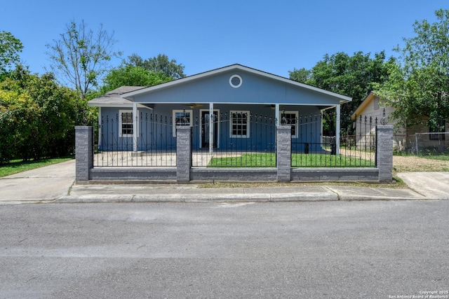 9015 Spanish Cv, San Antonio, TX 78242 - bungalow-style house with a ceiling fan, a fenced front yard, and covered porch