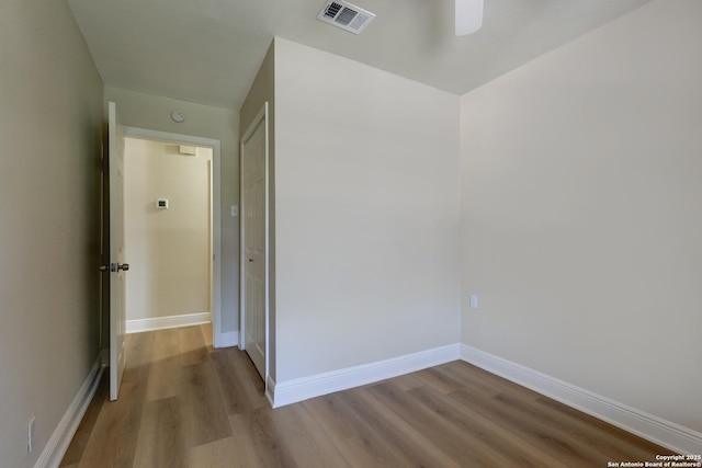 9015 Spanish Cv, San Antonio, TX 78242 - empty room with wood finished floors, baseboards, and a ceiling fan