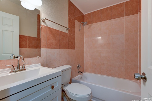 9015 Spanish Cv, San Antonio, TX 78242 - full bathroom featuring tile walls, shower / tub combination, toilet, and vanity