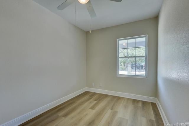 9015 Spanish Cv, San Antonio, TX 78242 - spare room with light wood finished floors, baseboards, and a ceiling fan