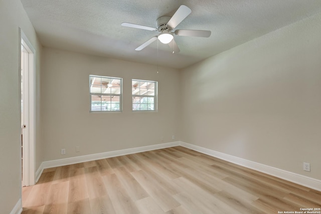 9015 Spanish Cv, San Antonio, TX 78242 - empty room featuring light wood finished floors, a textured ceiling, baseboards, and a ceiling fan