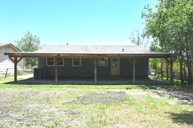 9015 Spanish Cv, San Antonio, TX 78242 - back of house with central AC, an attached carport, and fence