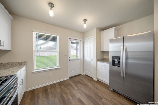 13758 Prospector Post, San Antonio, TX 78253 - kitchen with stainless steel appliances, dark wood-style flooring, white cabinets, baseboards, and light stone countertops