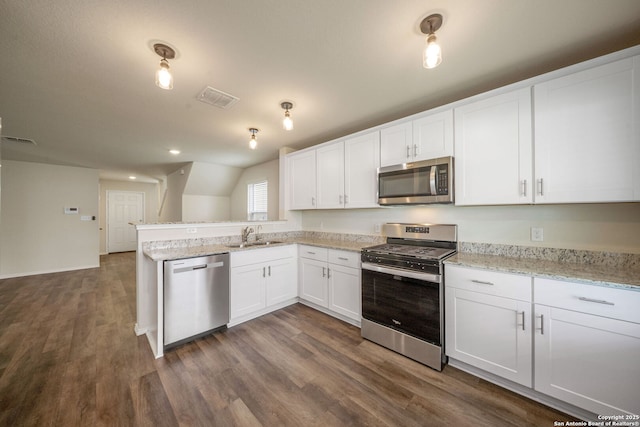 13758 Prospector Post, San Antonio, TX 78253 - kitchen with appliances with stainless steel finishes, a sink, dark wood-type flooring, a peninsula, and white cabinets