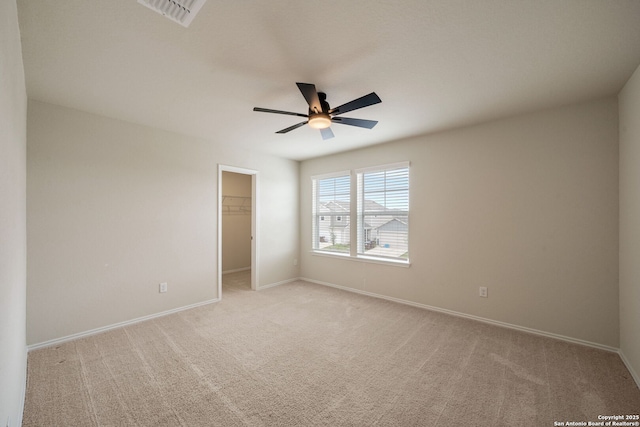 13758 Prospector Post, San Antonio, TX 78253 - unfurnished bedroom featuring light carpet, a walk in closet, and baseboards