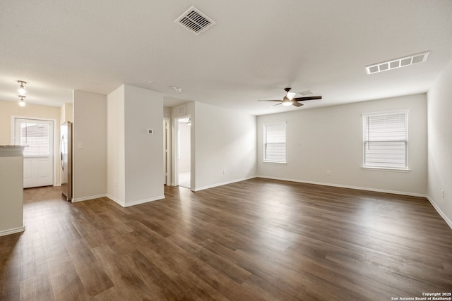 13758 Prospector Post, San Antonio, TX 78253 - empty room featuring a ceiling fan, dark wood-type flooring, and baseboards