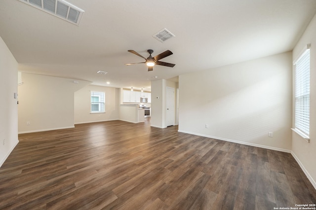13758 Prospector Post, San Antonio, TX 78253 - unfurnished living room featuring ceiling fan, dark wood-style flooring, and baseboards