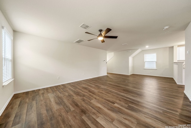 13758 Prospector Post, San Antonio, TX 78253 - unfurnished living room featuring ceiling fan, dark wood-type flooring, plenty of natural light, and baseboards