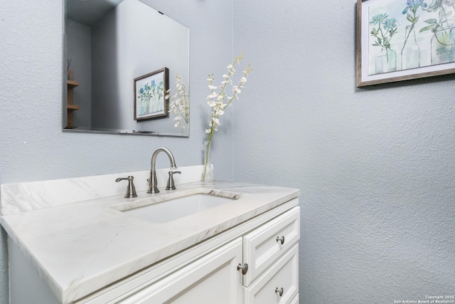 125 Stone Cyn, Fredericksburg, TX 78624 - bathroom with vanity and a textured wall