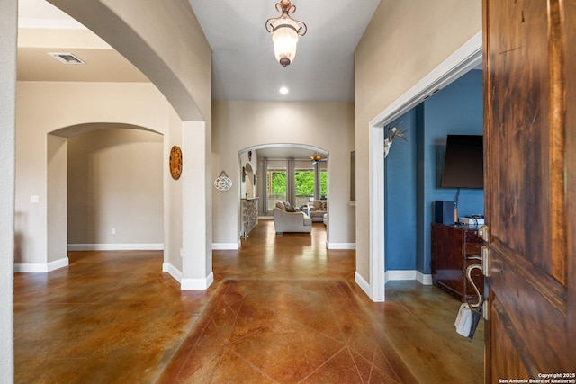 125 Stone Cyn, Fredericksburg, TX 78624 - entrance foyer featuring arched walkways, finished concrete flooring, recessed lighting, and baseboards