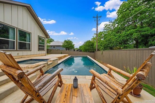 125 Stone Cyn, Fredericksburg, TX 78624 - view of pool featuring a fenced backyard, a pool with connected hot tub, and a patio