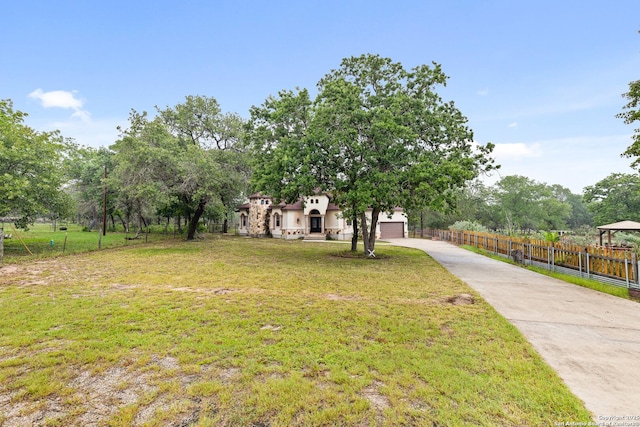 105 Saddle Up, La Vernia, TX 78121 - view of front of property with concrete driveway and an attached garage