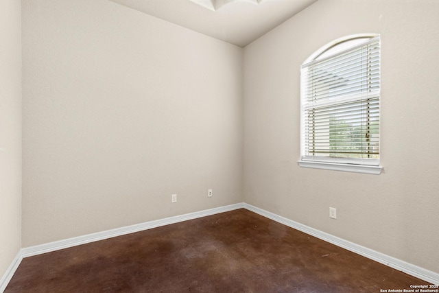 105 Saddle Up, La Vernia, TX 78121 - spare room with concrete flooring and baseboards