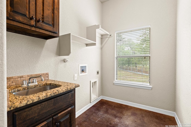 105 Saddle Up, La Vernia, TX 78121 - laundry room with hookup for an electric dryer, cabinet space, baseboards, and washer hookup