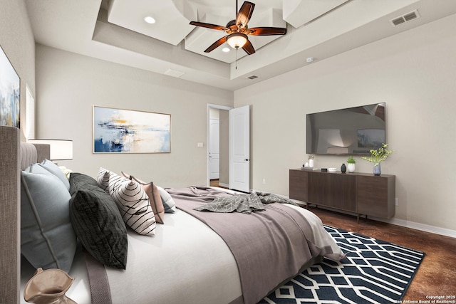 105 Saddle Up, La Vernia, TX 78121 - bedroom with a raised ceiling, concrete floors, baseboards, a ceiling fan, and recessed lighting