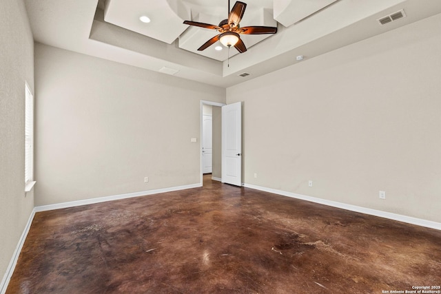 105 Saddle Up, La Vernia, TX 78121 - unfurnished room featuring concrete flooring, a raised ceiling, a ceiling fan, baseboards, and recessed lighting