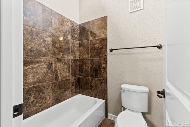 105 Saddle Up, La Vernia, TX 78121 - bathroom with toilet and a textured wall