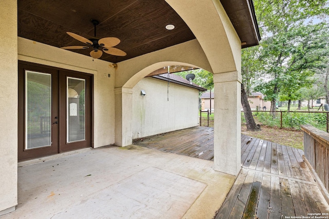 105 Saddle Up, La Vernia, TX 78121 - wooden terrace featuring french doors, fence, ceiling fan, and a patio area