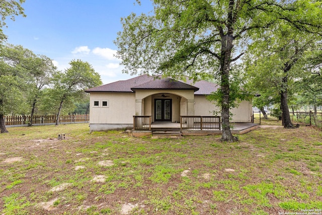 105 Saddle Up, La Vernia, TX 78121 - view of front of home with french doors, roof with shingles, and stucco siding