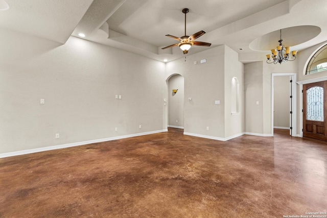 105 Saddle Up, La Vernia, TX 78121 - entryway with finished concrete floors, arched walkways, a tray ceiling, ceiling fan, and a chandelier