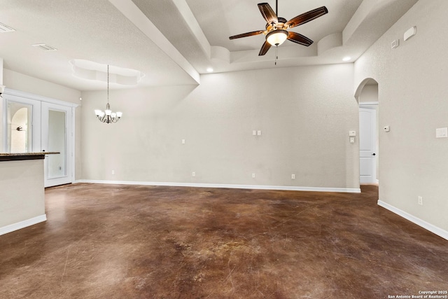 105 Saddle Up, La Vernia, TX 78121 - empty room with concrete flooring, ceiling fan, arched walkways, a chandelier, and baseboards
